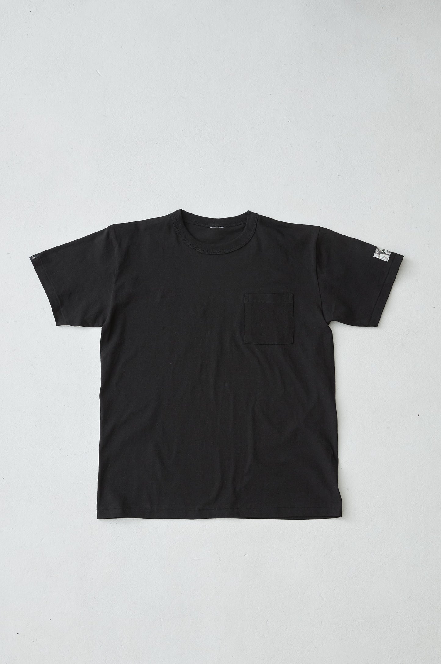 W name pocket over T-shirt