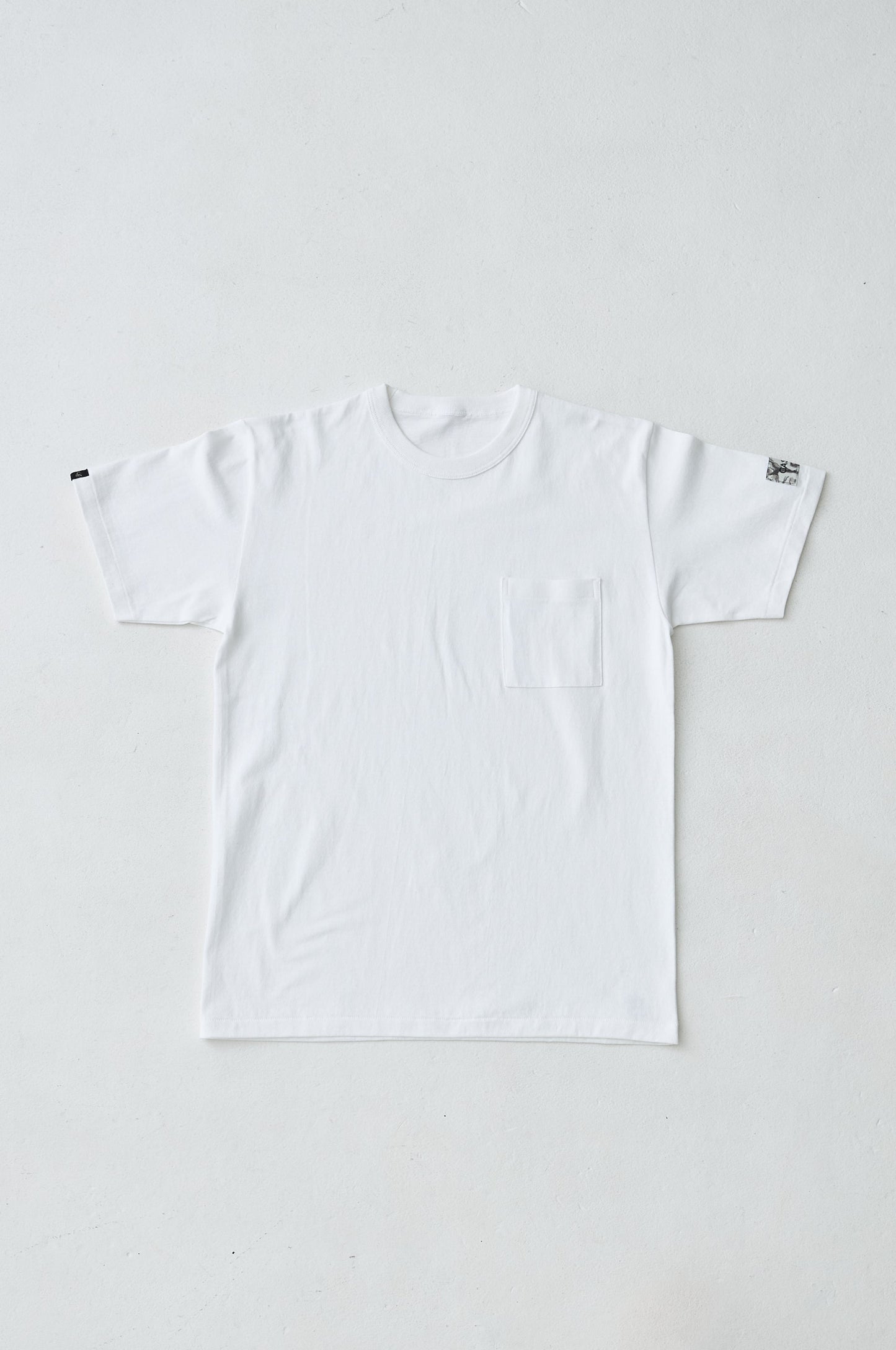 W name pocket over T-shirt