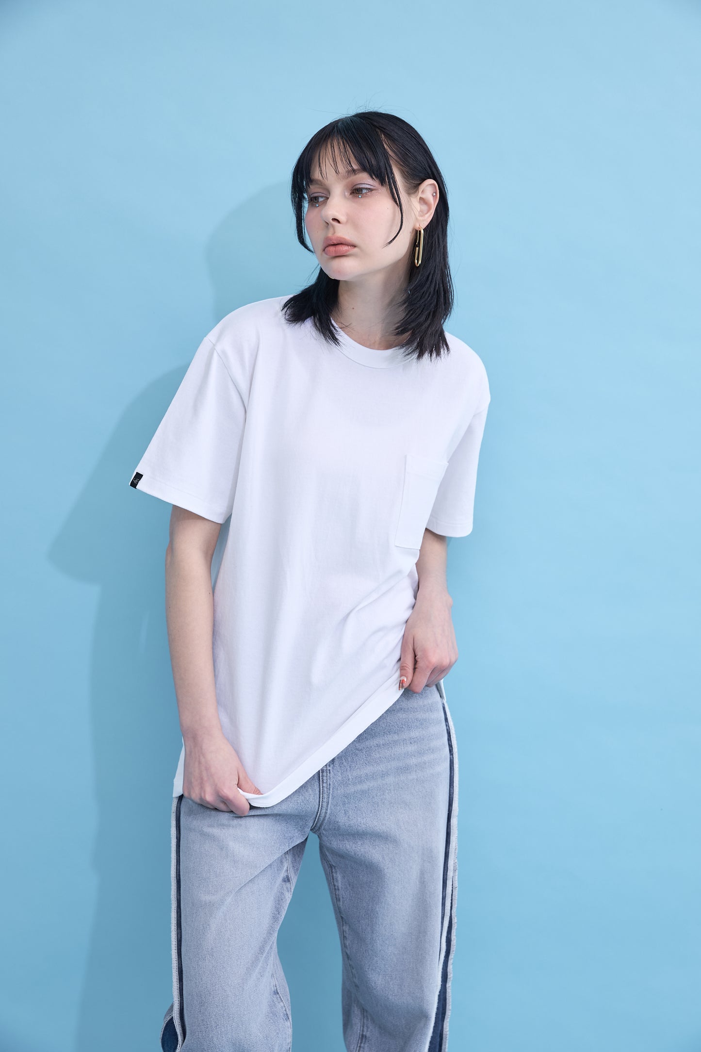 W name pocket over T-shirt