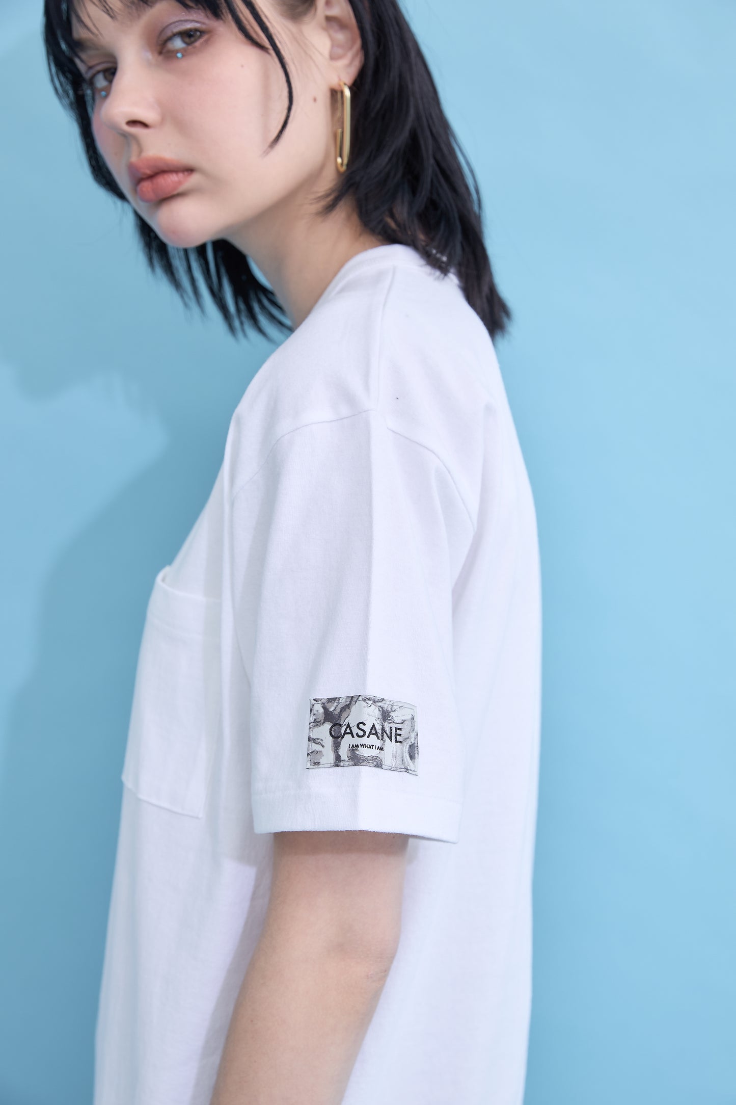 W name pocket over T-shirt