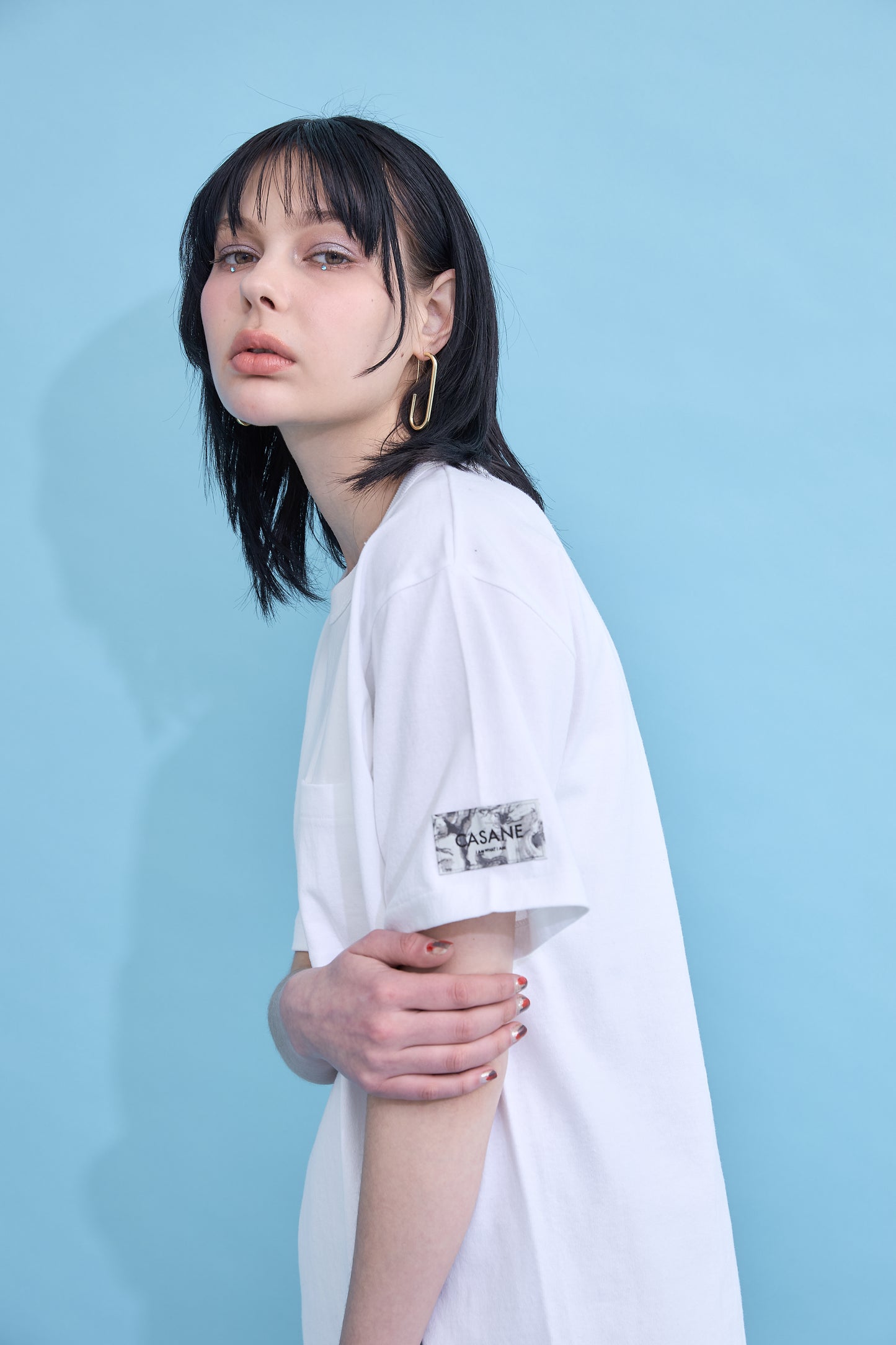 W name pocket over T-shirt