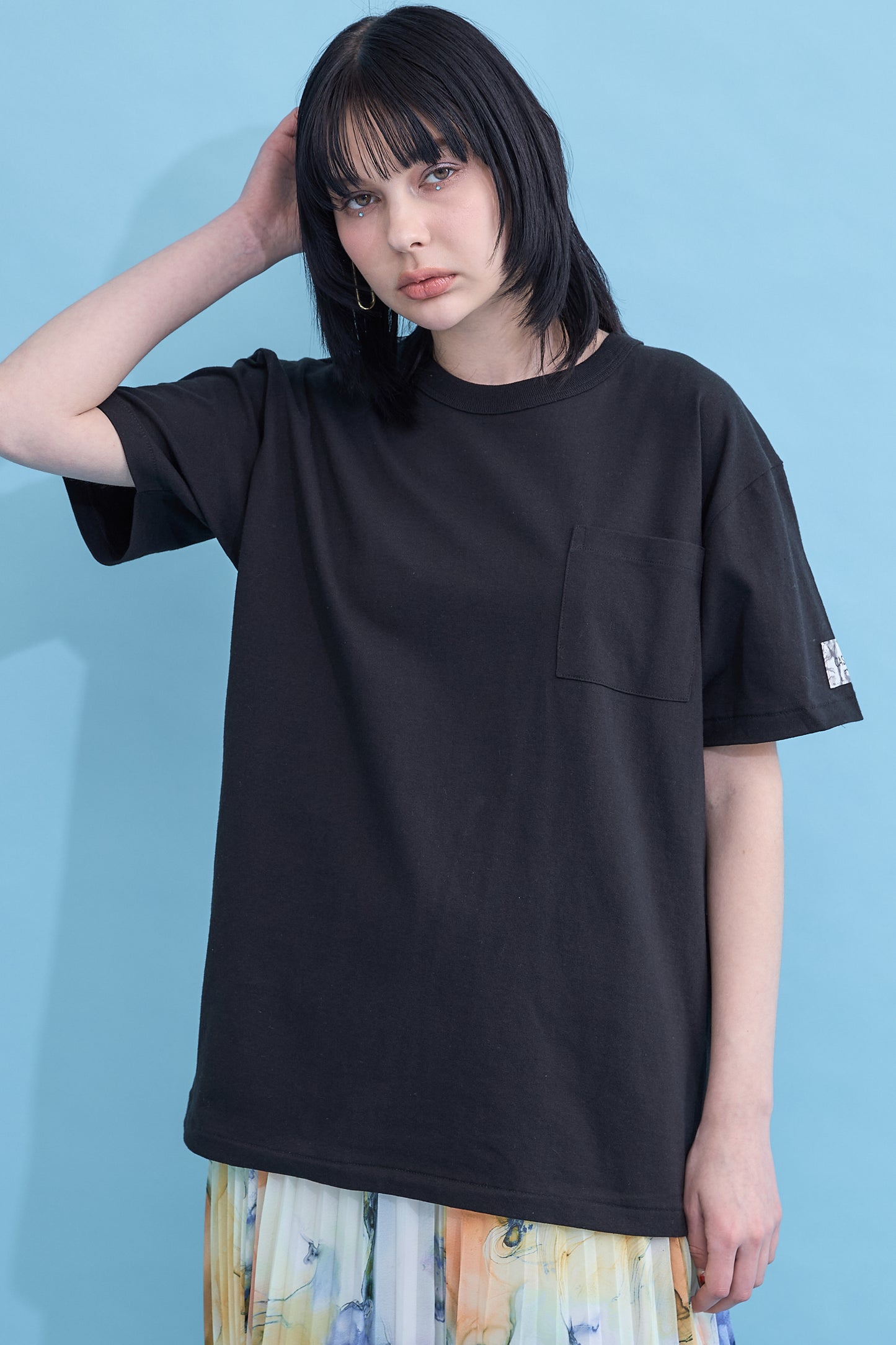 W name pocket over T-shirt