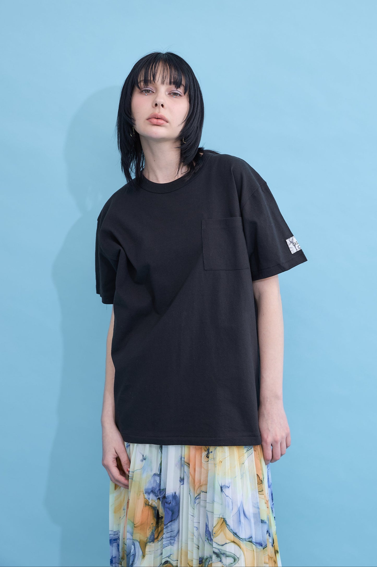 W name pocket over T-shirt