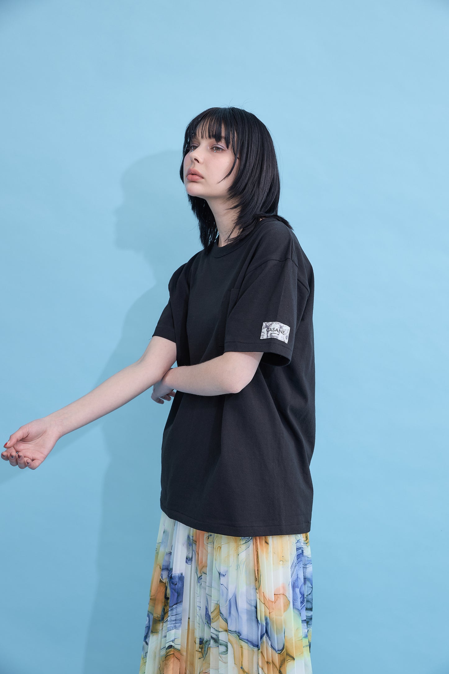 W name pocket over T-shirt