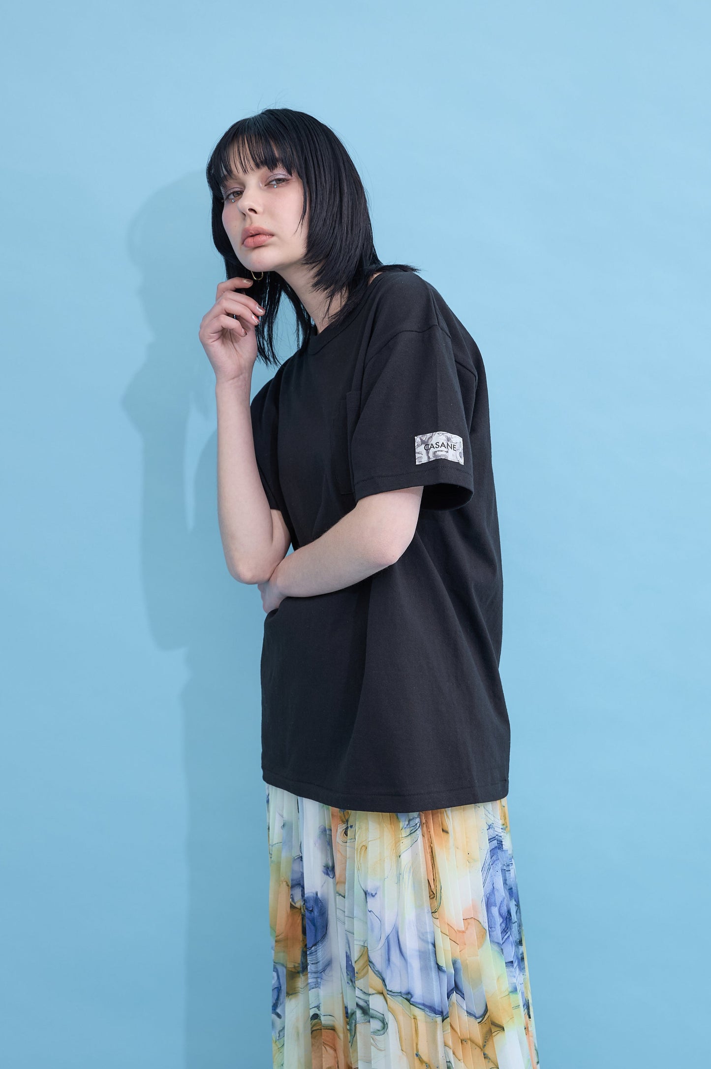 W name pocket over T-shirt