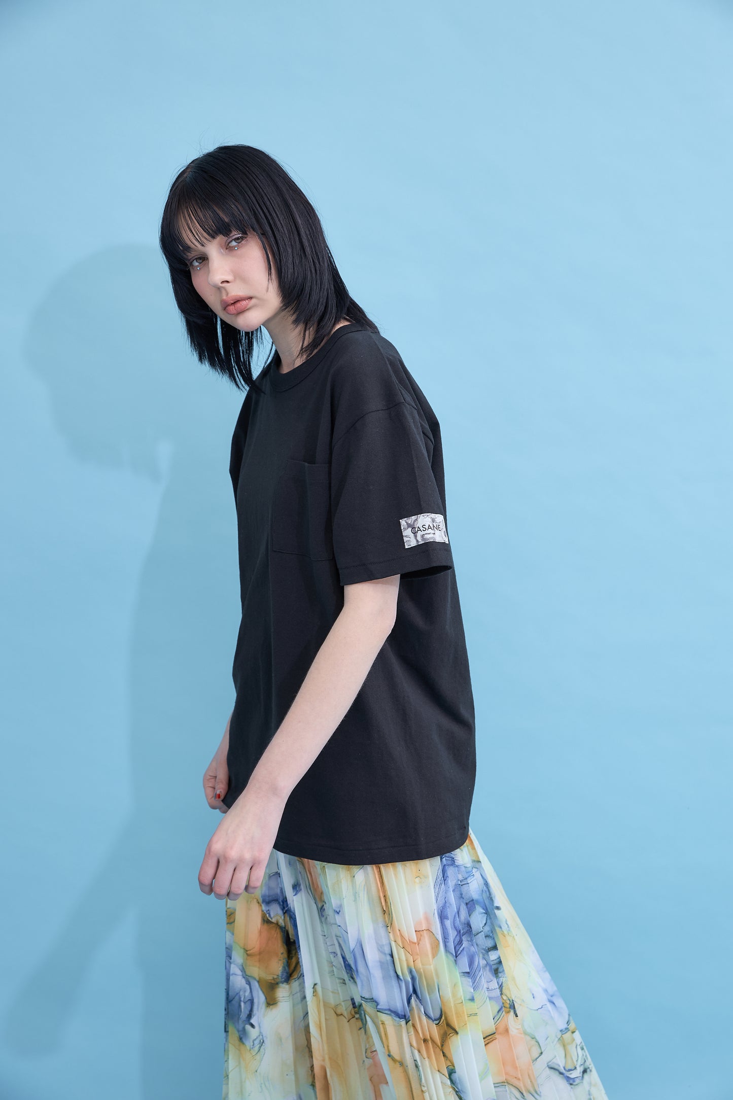 W name pocket over T-shirt