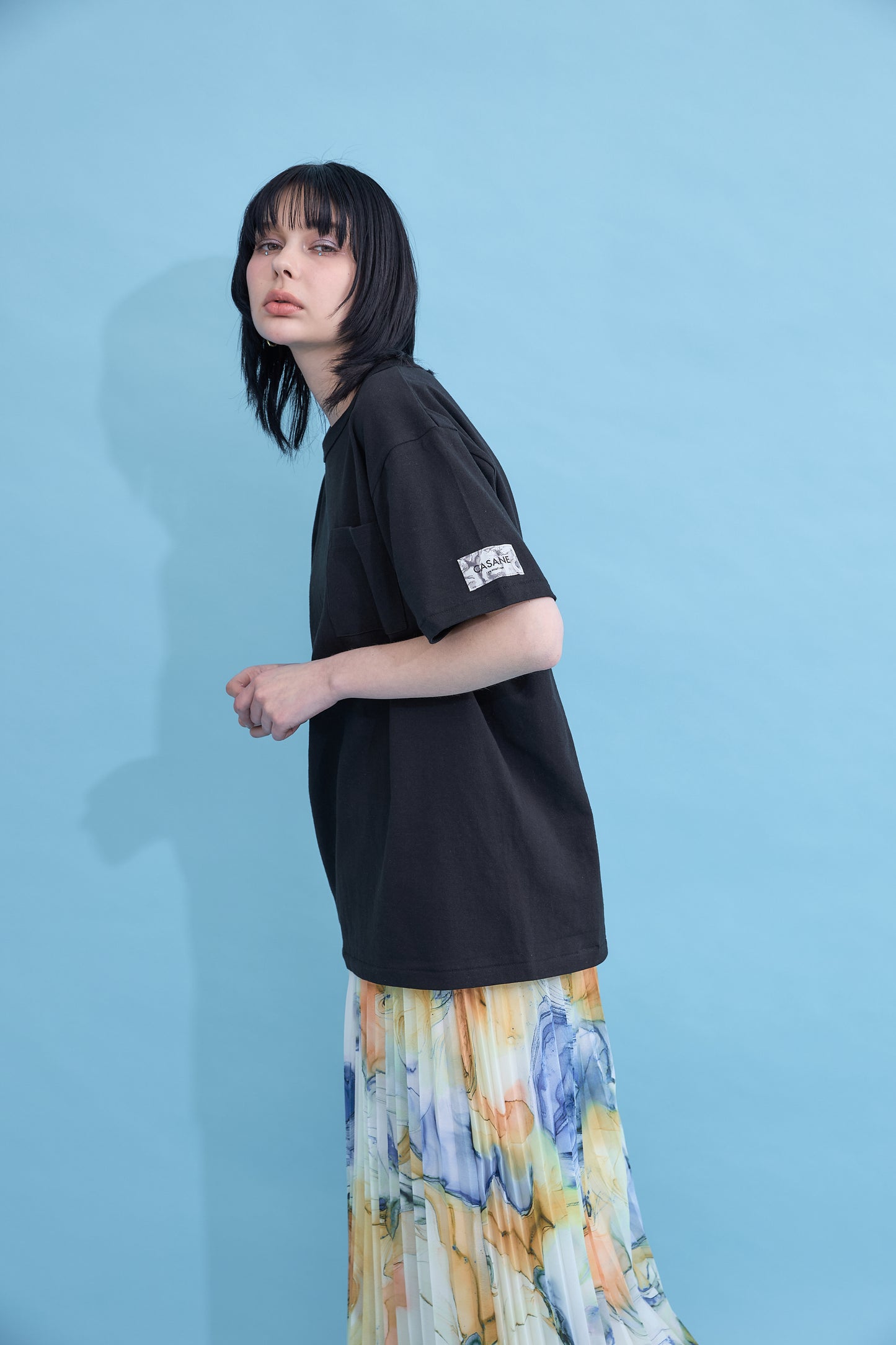 W name pocket over T-shirt