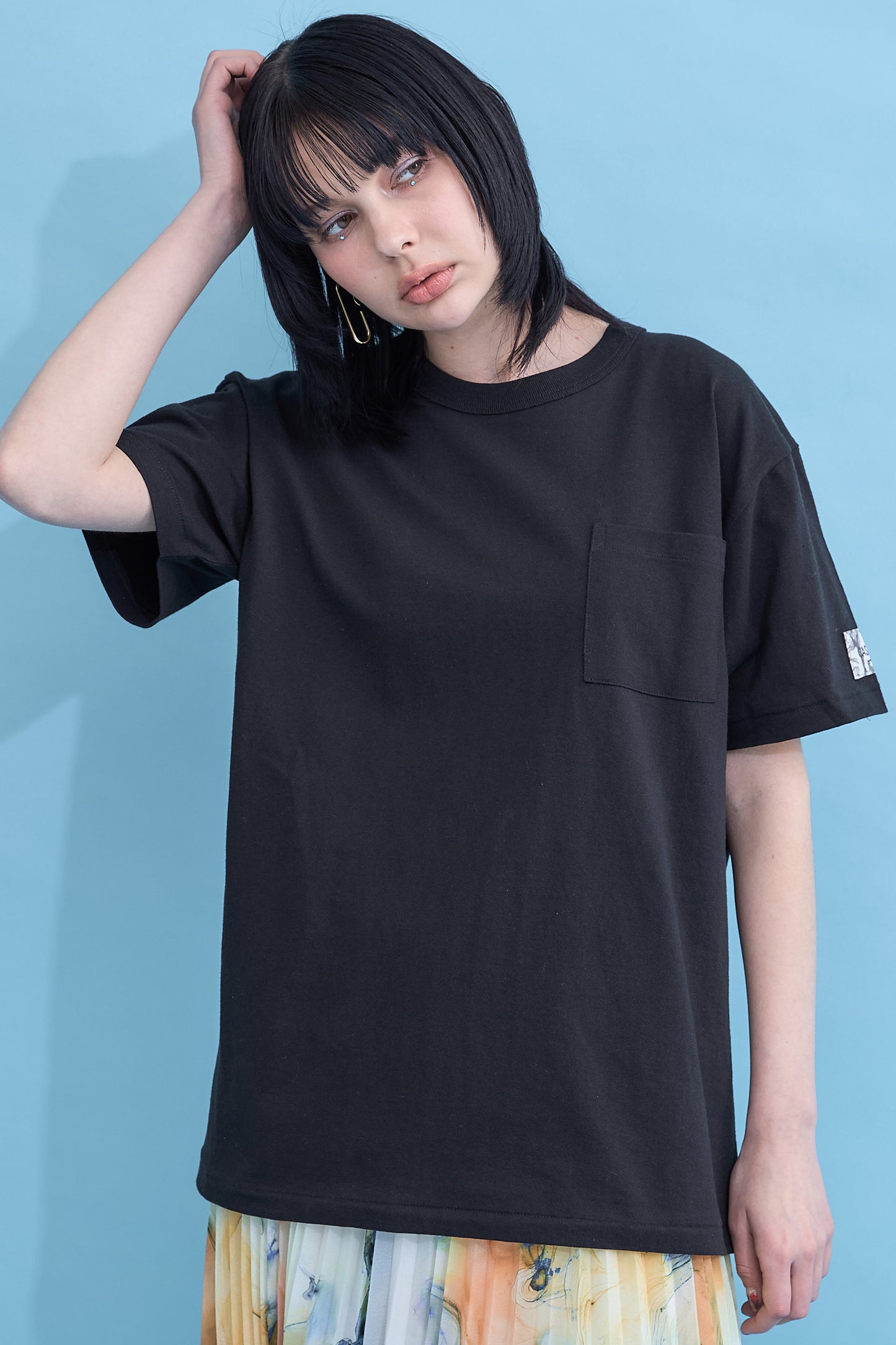 W name pocket over T-shirt