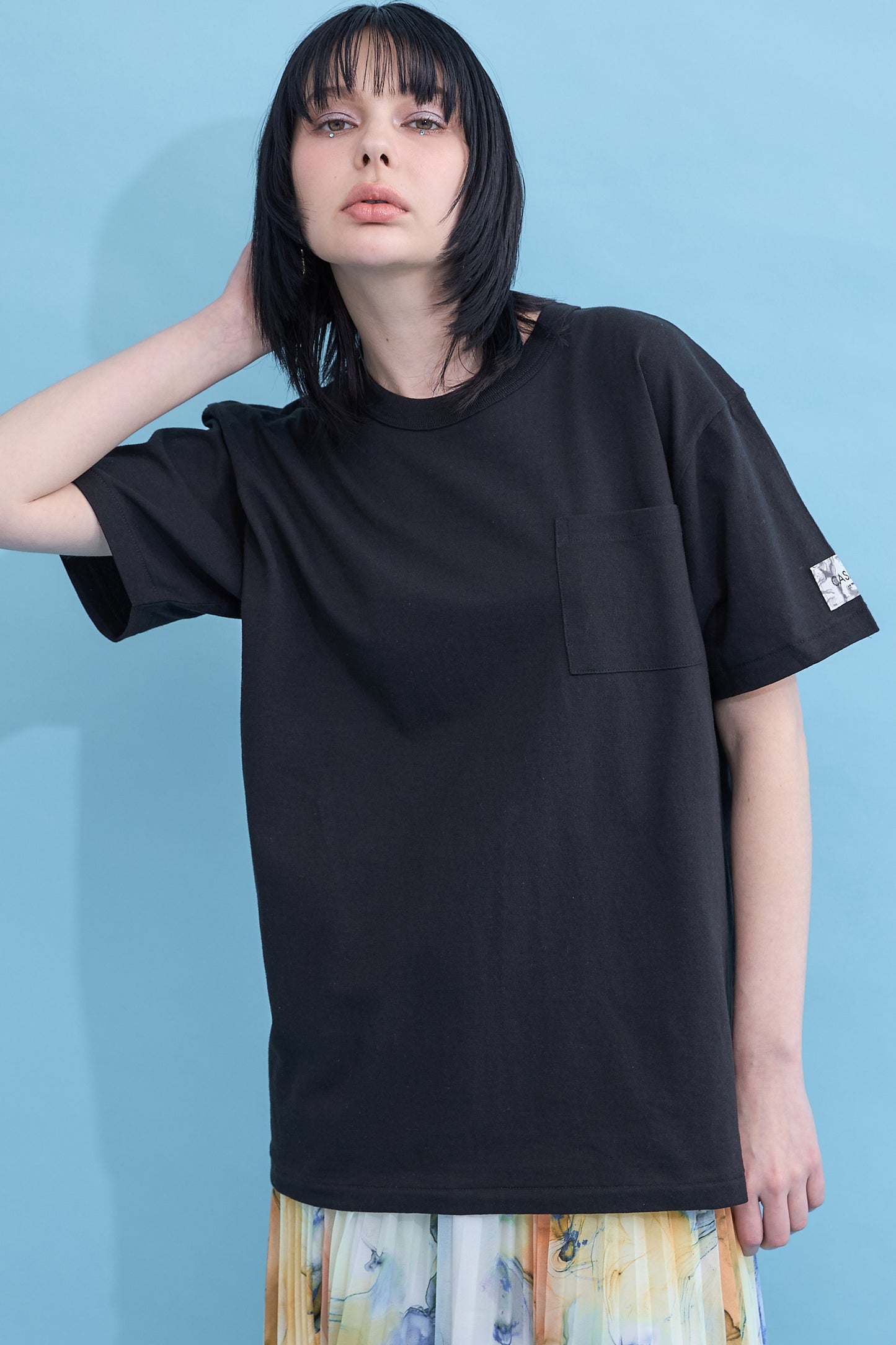 W name pocket over T-shirt