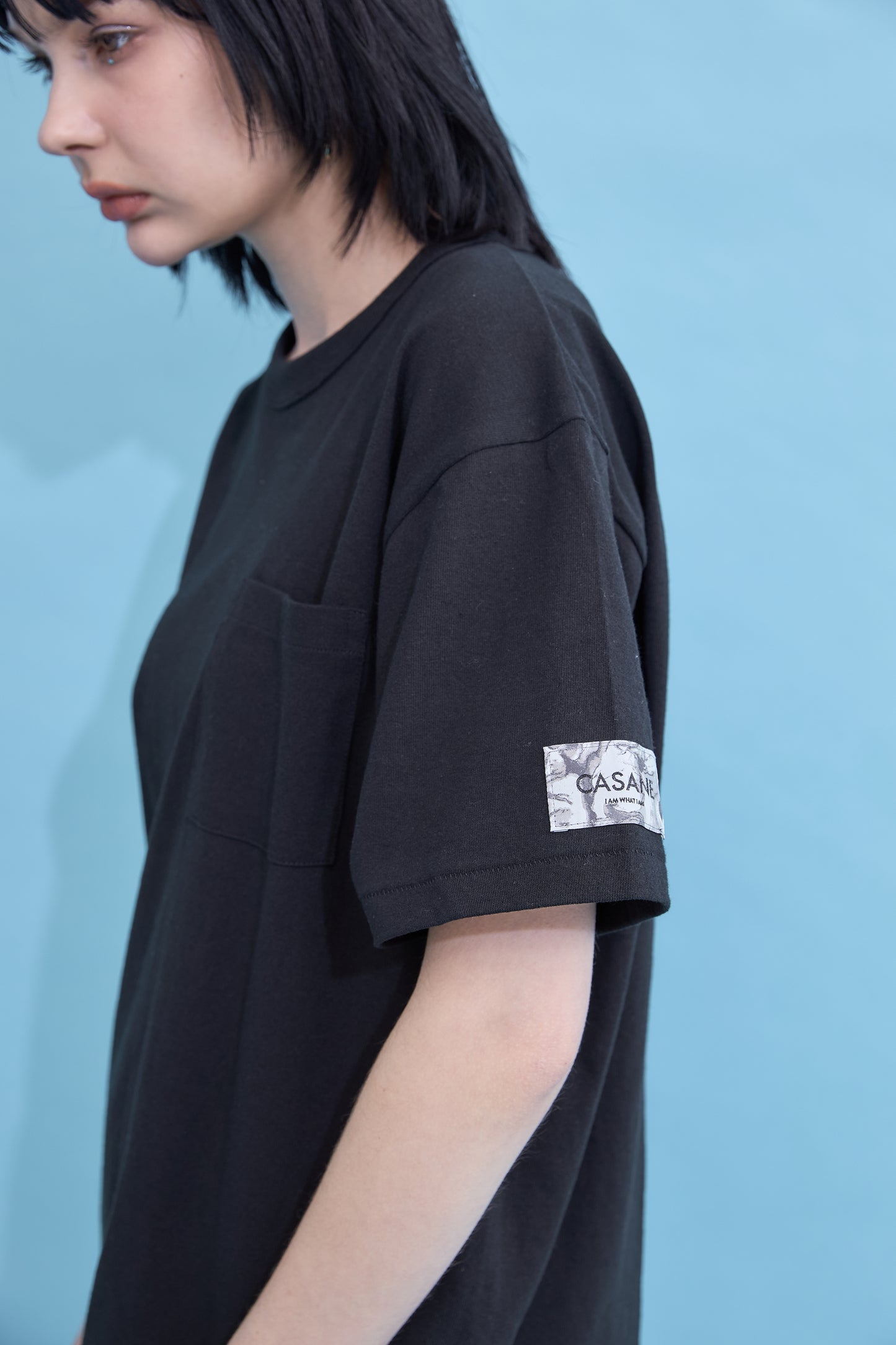 W name pocket over T-shirt