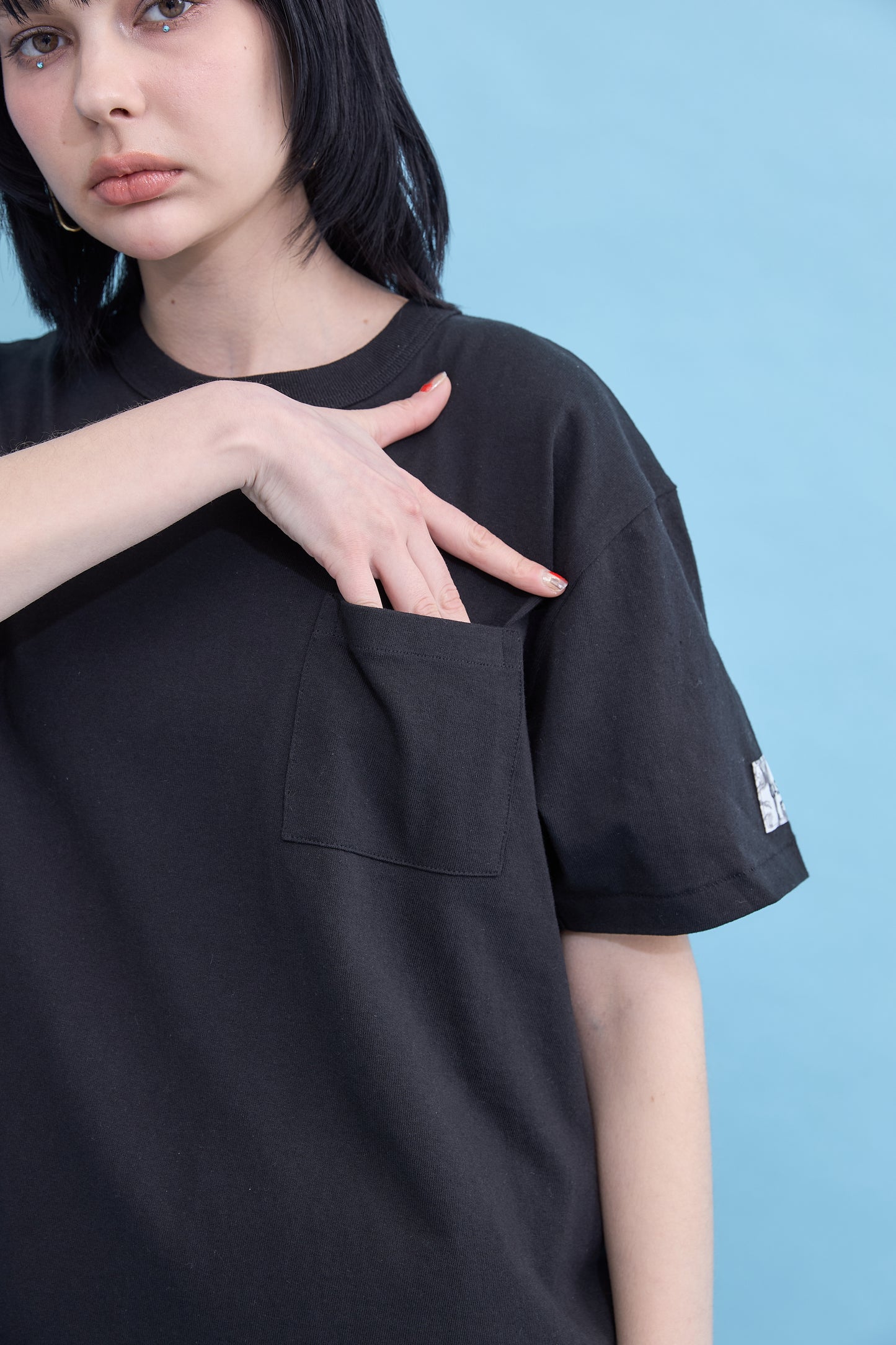 W name pocket over T-shirt