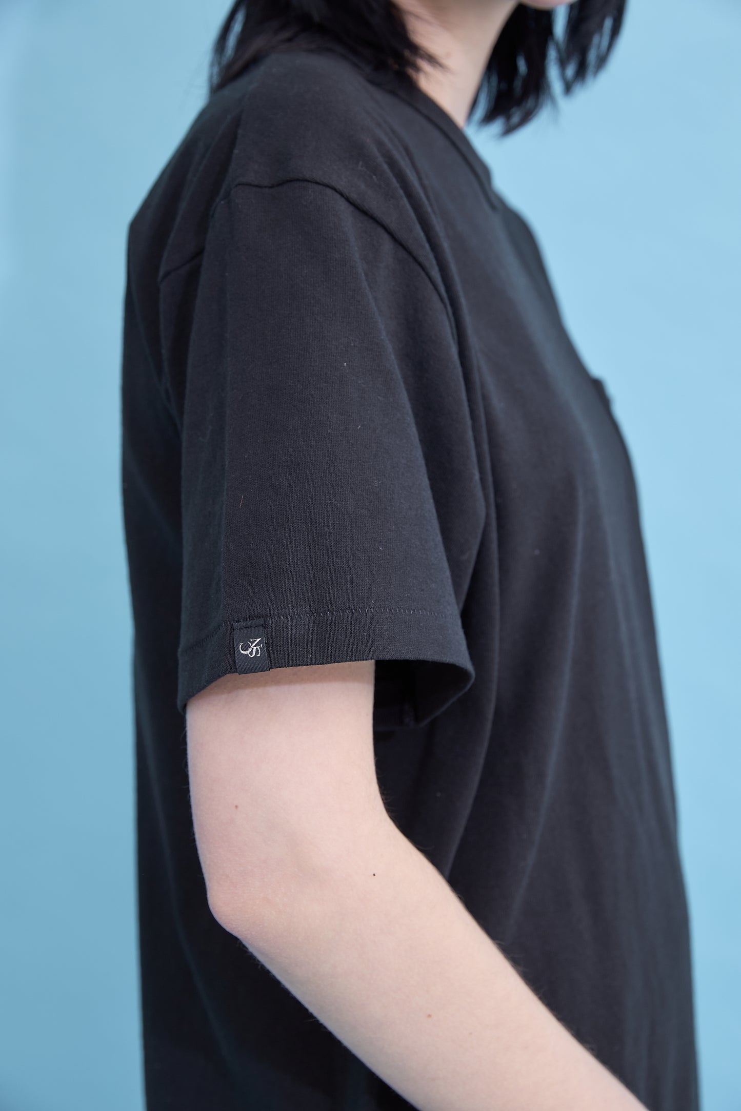 W name pocket over T-shirt