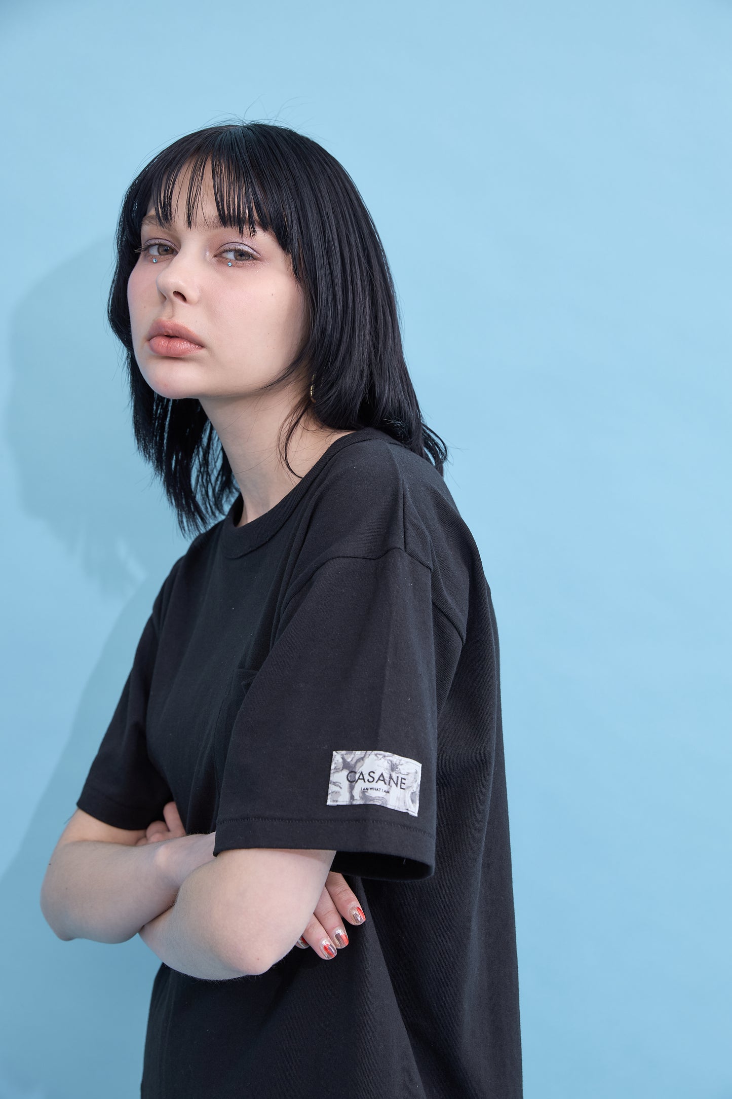 W name pocket over T-shirt