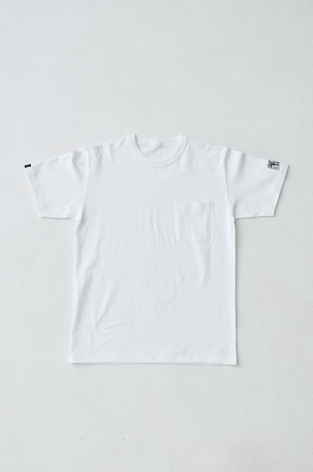 W name pocket over T-shirt