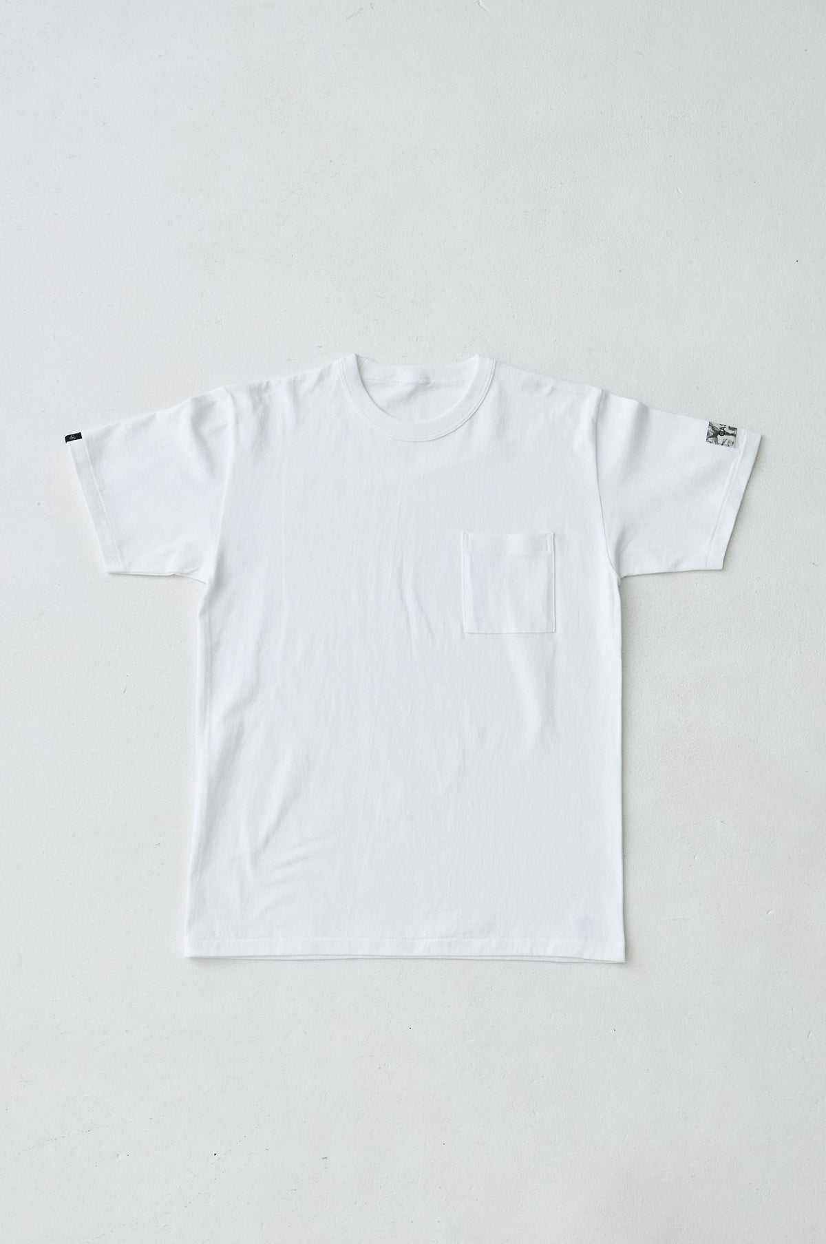 W name pocket over T-shirt