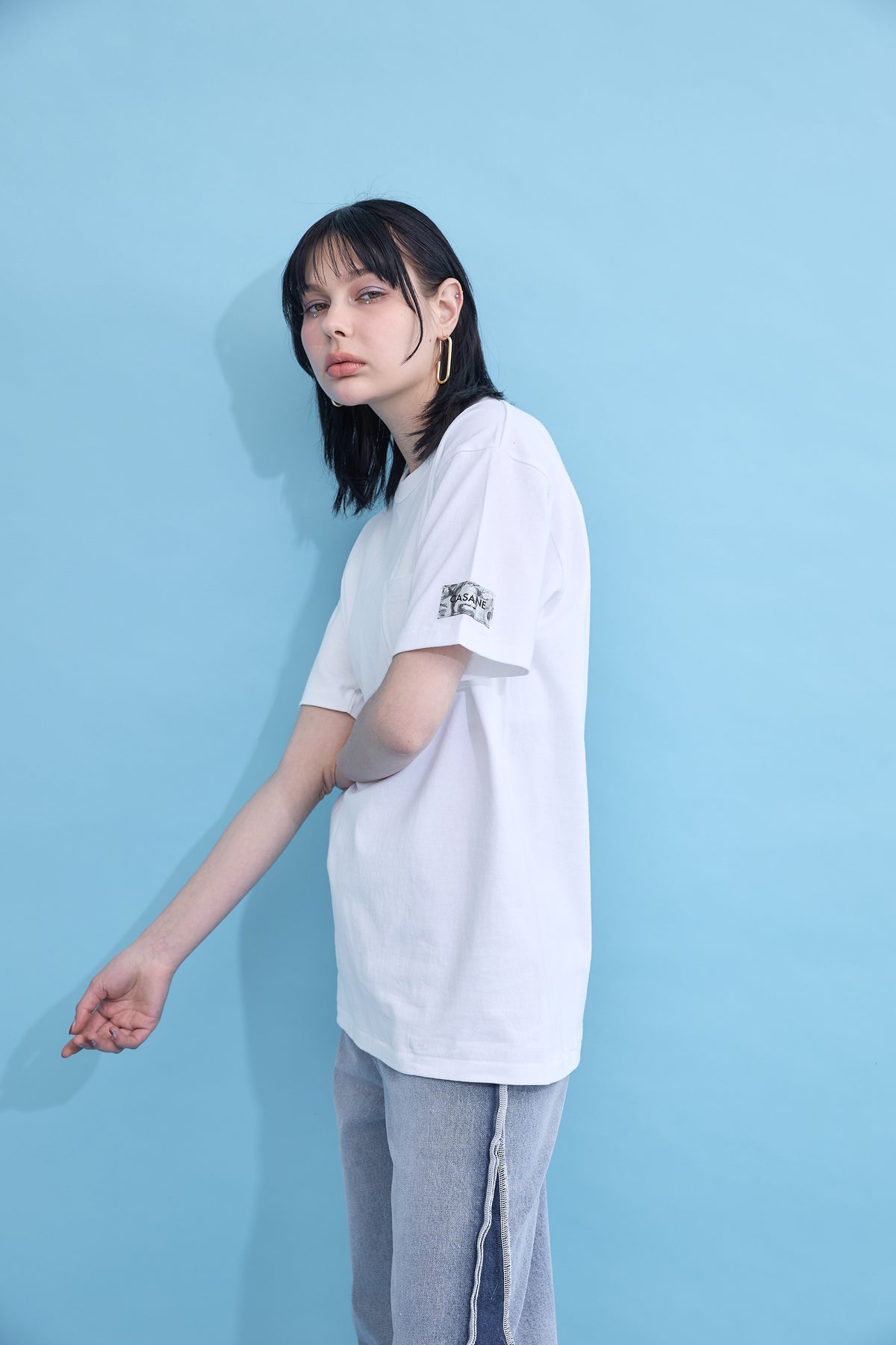 W name pocket over T-shirt