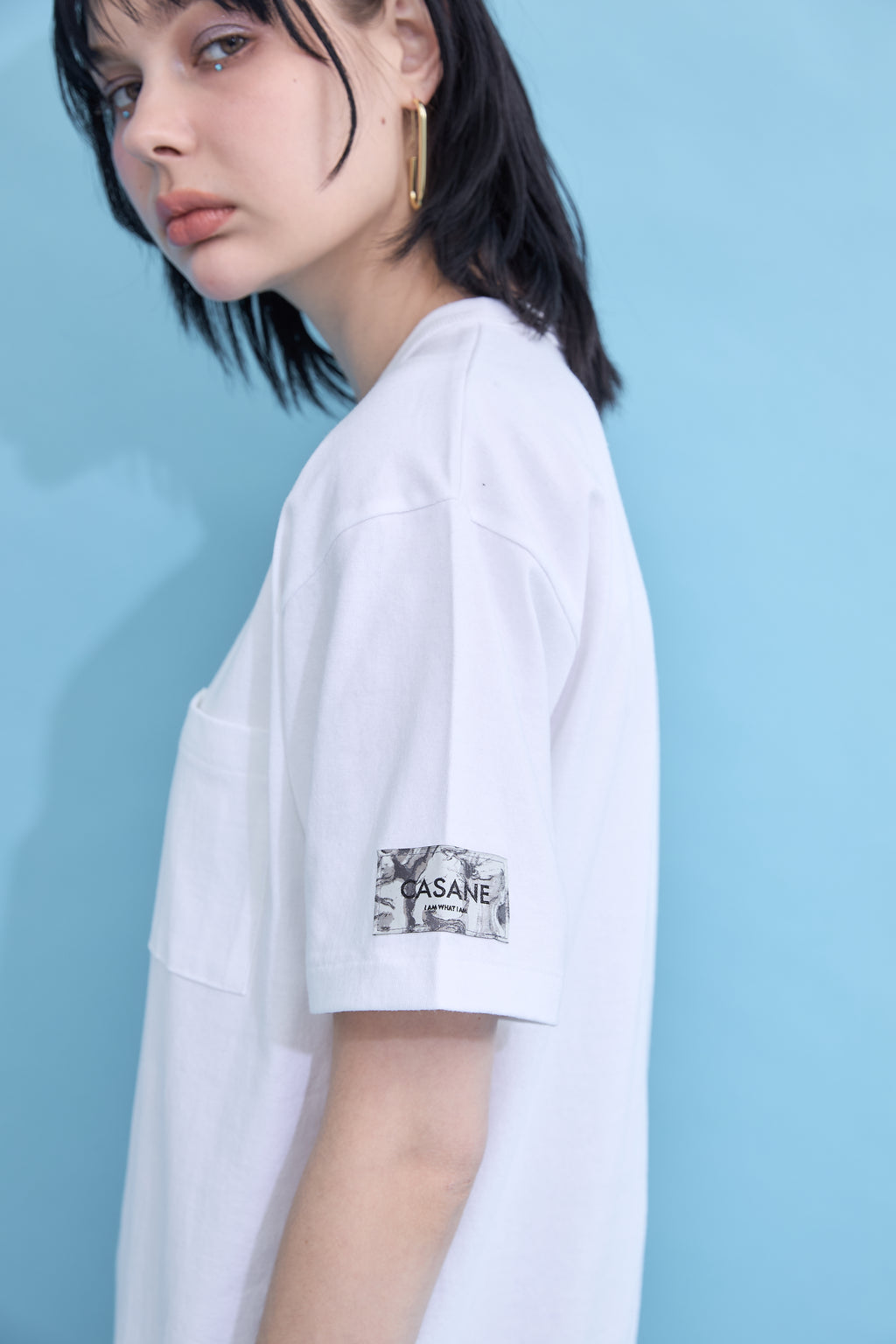 W name pocket over T-shirt