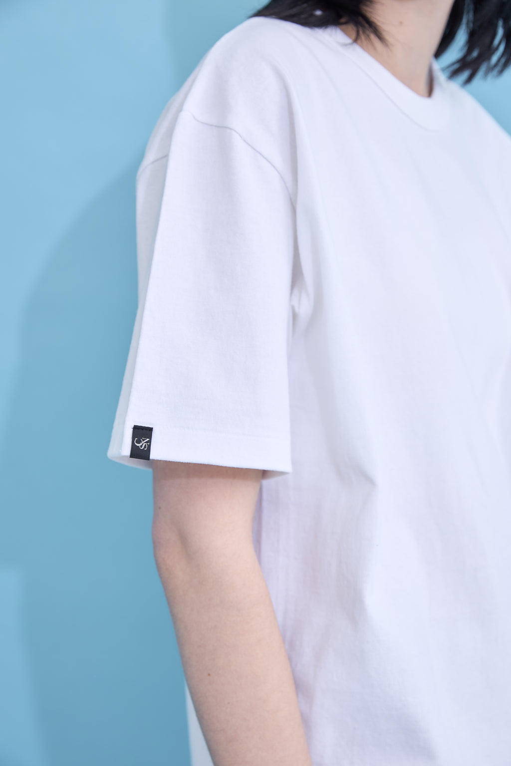 W name pocket over T-shirt