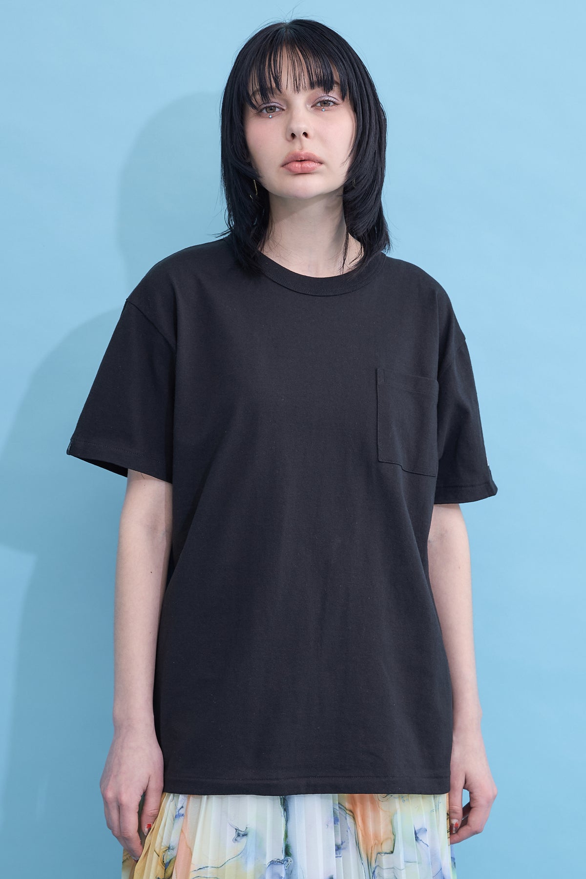 W name pocket over T-shirt