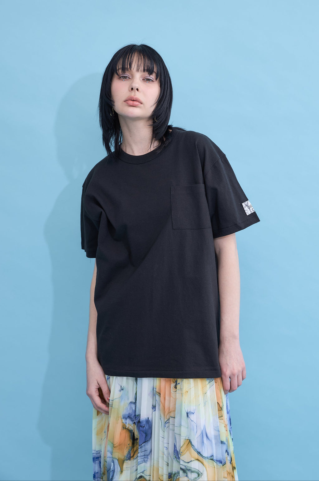 W name pocket over T-shirt