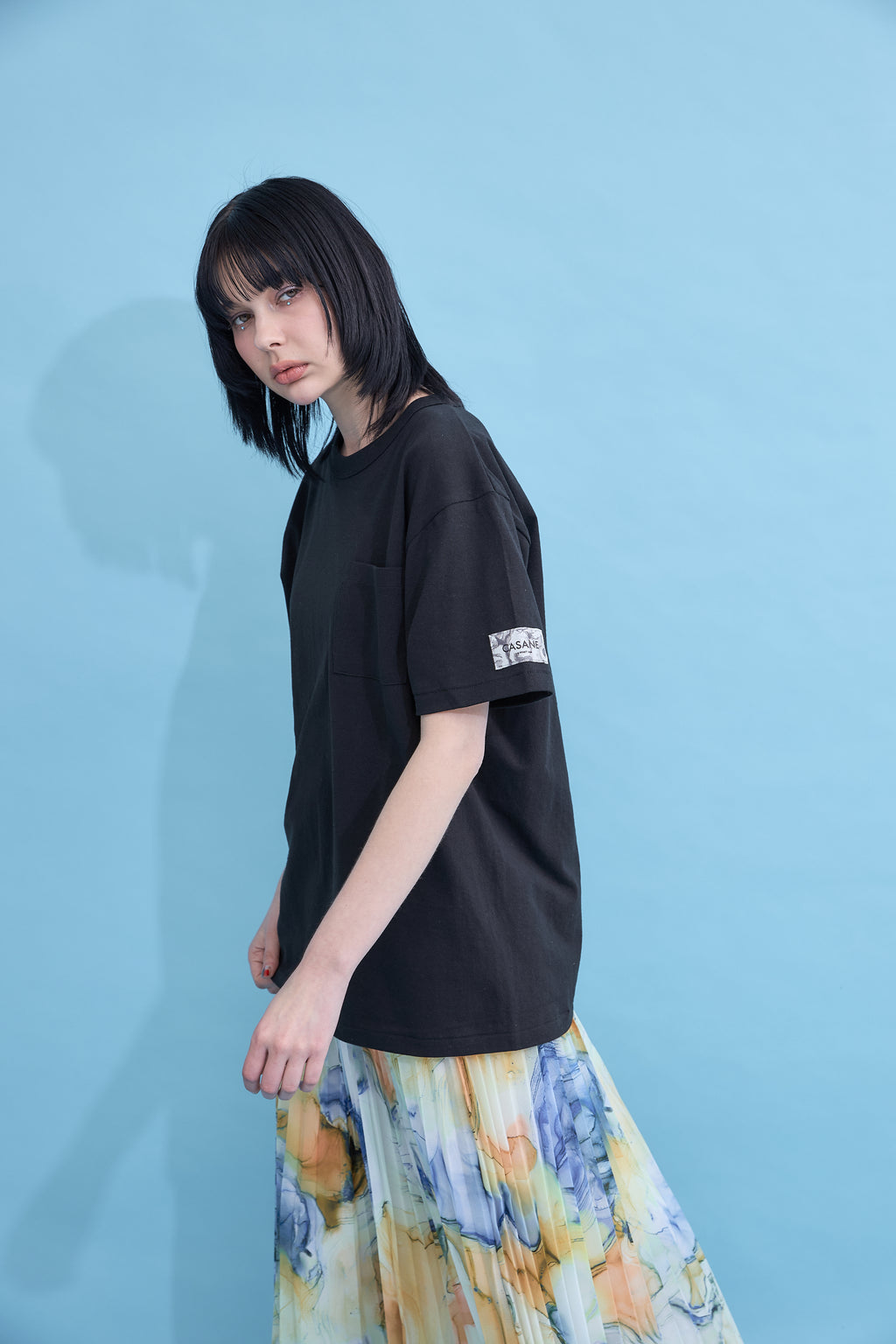 W name pocket over T-shirt