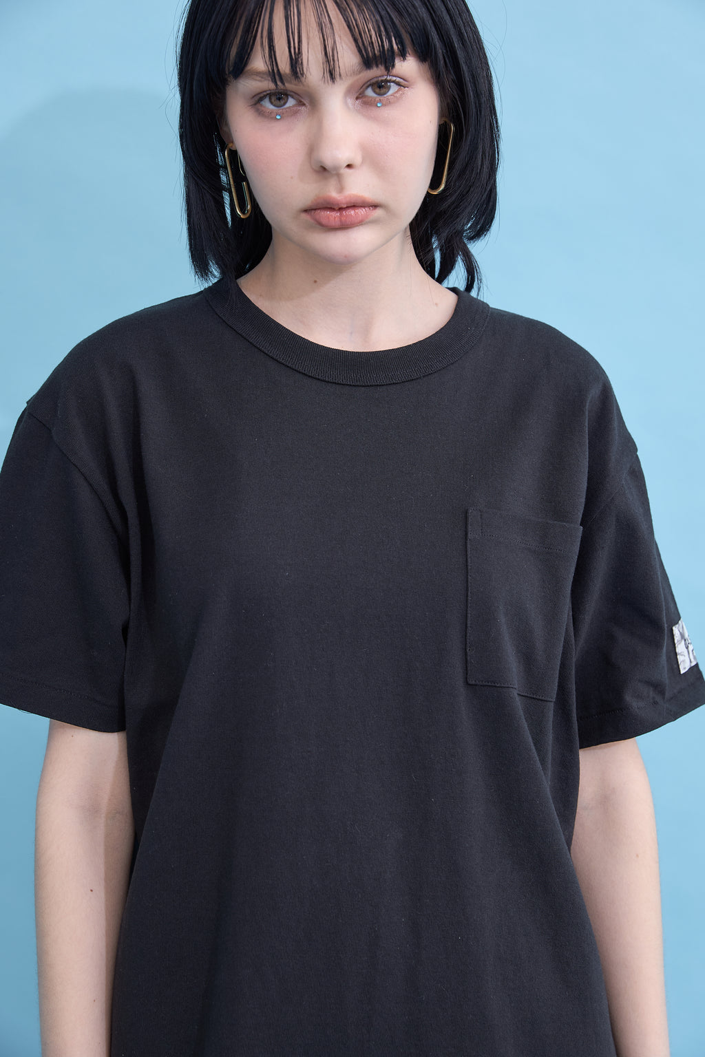 W name pocket over T-shirt