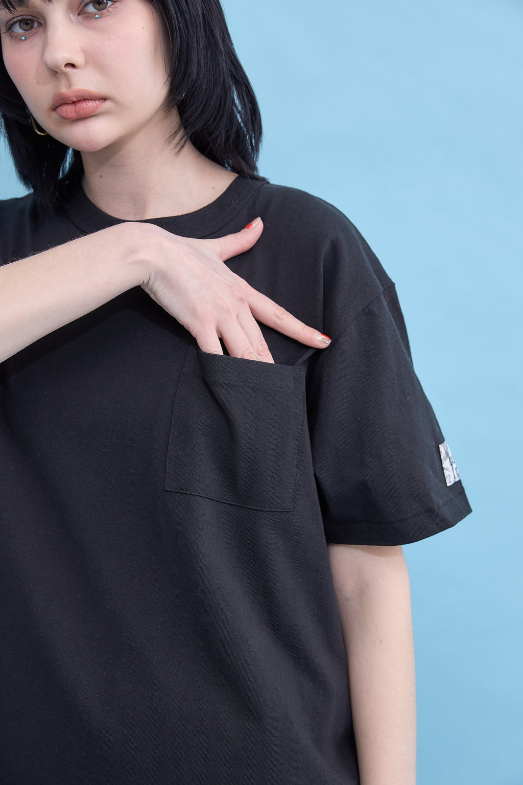 W name pocket over T-shirt