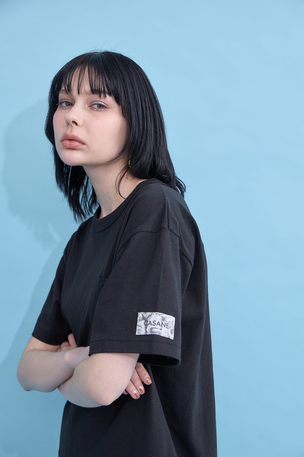 W name pocket over T-shirt