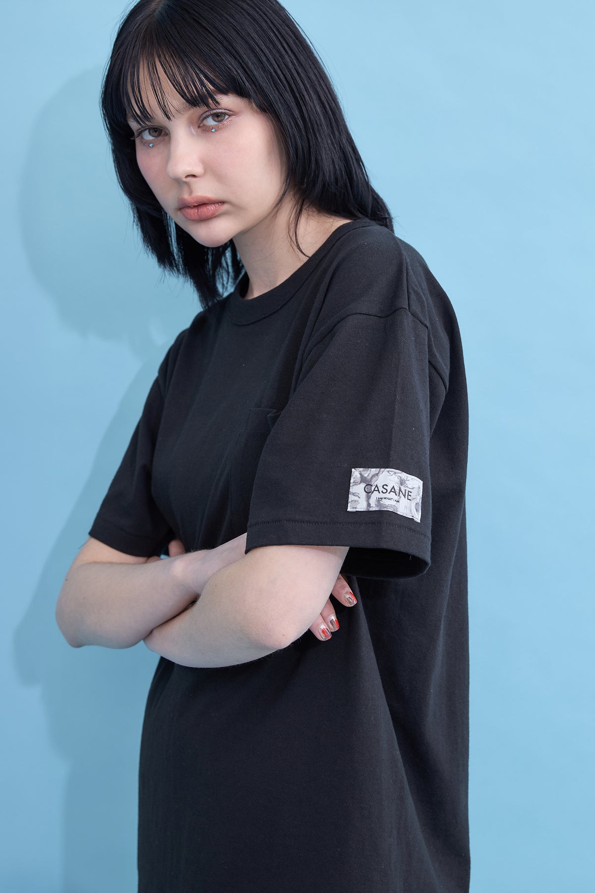 W name pocket over T-shirt